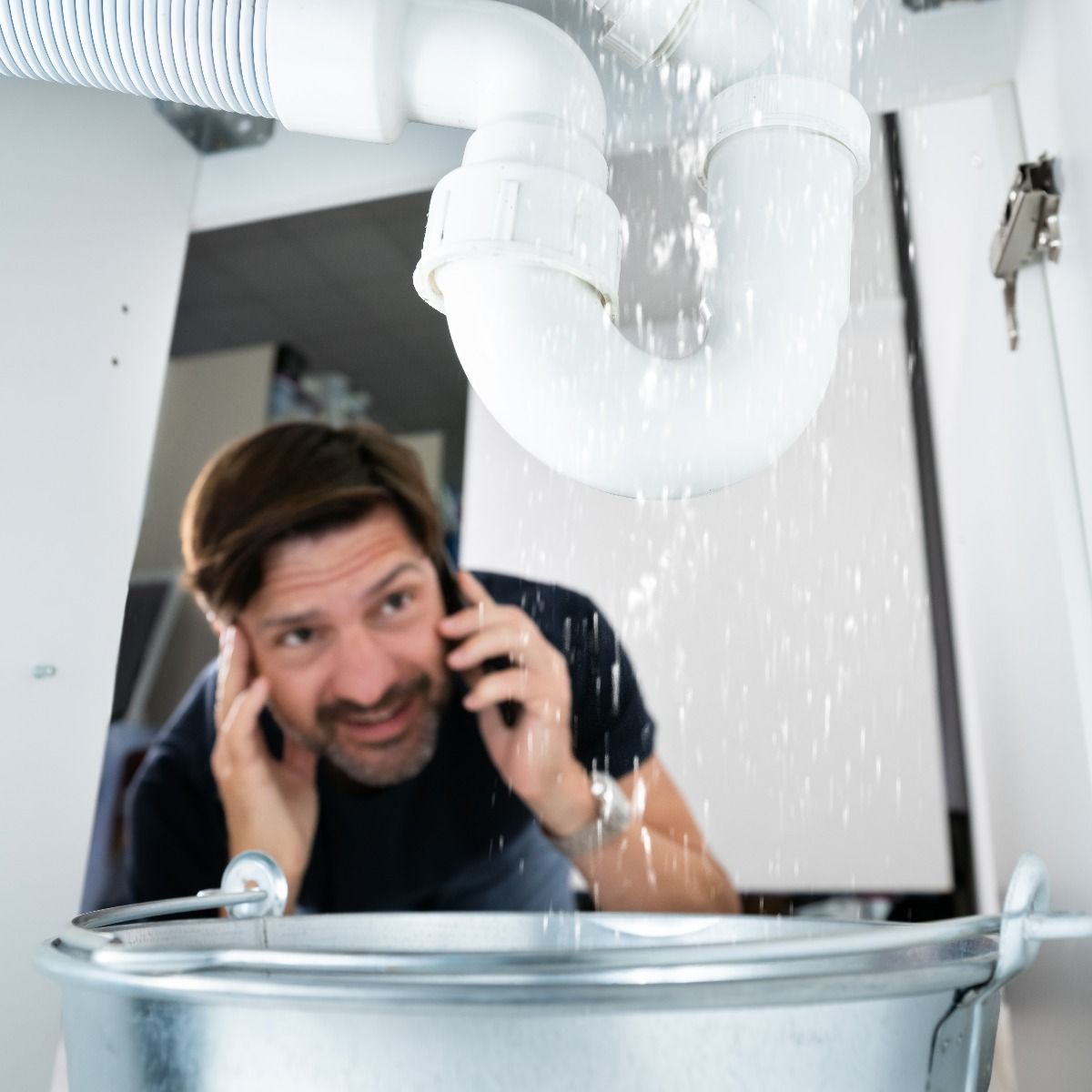 A man tensed on call due to plumbing issues