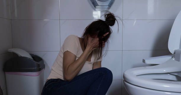 The depression asian woman sit on the floor in bathroom